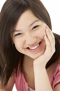 Studio Portrait of Smiling Teenage Girl