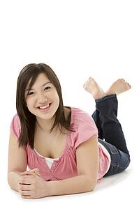 Teenage Girl Laying on Stomach