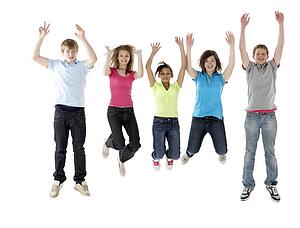 Group of Teenage Friends Jumping in Studio