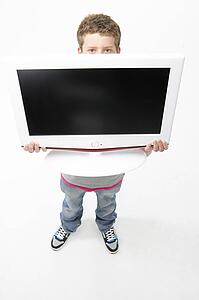 Portrait of Smiling Teenage Boy Holding Television