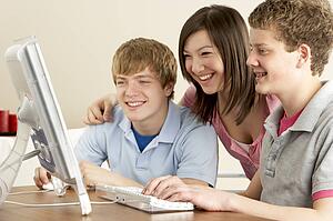 Teenagers on Computer at Home