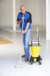 Cleaner mopping office floor