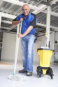 Cleaner mopping office floor