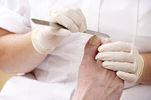 Chirpodist treating client in clinic
