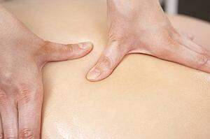 Close Up of female masseuse with client