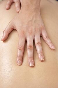 Close Up of female masseuse with client