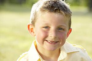 Portrait of young boy in countryside