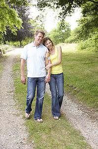 Middle aged couple walking in countryside