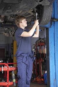 Mechanic working on car