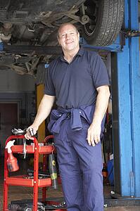 Mechanic working on car