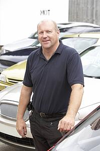 Car salesman standing on lot