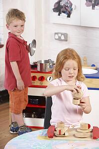 Two Young Children Playing Together at Montessori/Pre-School