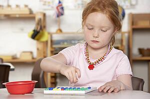 Young Boy Playing at Montessori/Pre-School
