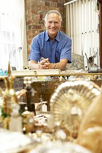 Male antique shop proprietor