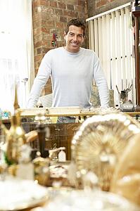 Male antique shop proprietor