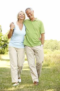 Mature couple walking in countryside