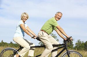 Mature couple riding tandem