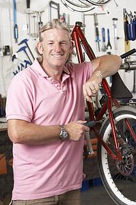 Owner of cycle shop in workshop