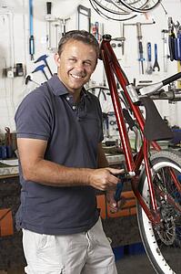Owner of cycle shop in workshop