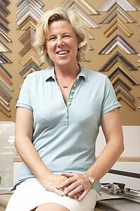 Female picture framer at work