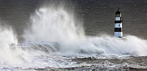 Waves crashing on a lighthouse, Seaham, Teesside, England