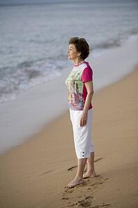 Woman standing on the beach, Maui, Hawaii, USA