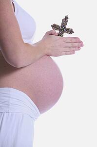Pregnant woman praying