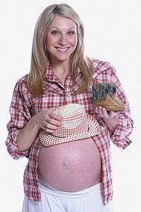 Pregnant lady with tiny cowboy boots and cowboy hat