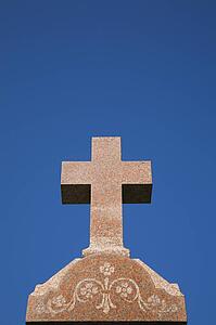 Granite cross on top of a Headstone in a cemetery, Laval, Quebec, Canada