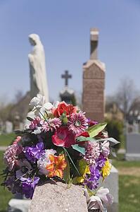 Bouquet of artificial flowers at a cemetery; Laval, Quebec, Canada