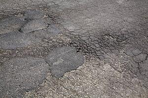 Cracked asphalt pavement