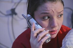 Worried teenage girl on the phone