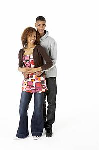 Studio Portrait Of Teenage Couple
