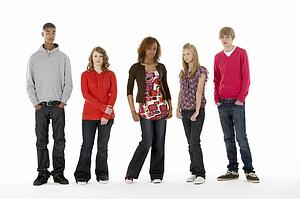 Full Length Studio Portrait Of Five Teenage Friends
