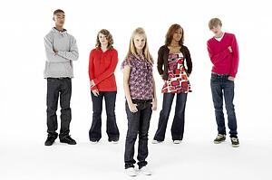 Full Length Studio Portrait Of Five Teenage Friends