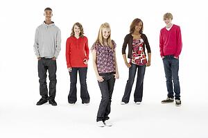Full Length Studio Portrait Of Five Teenage Friends