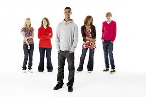 Full Length Studio Portrait Of Five Teenage Friends