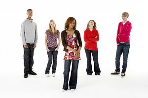 Full Length Studio Portrait Of Five Teenage Friends