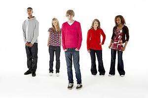 Full Length Studio Portrait Of Five Teenage Friends