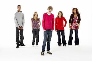 Full Length Studio Portrait Of Five Teenage Friends