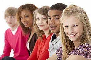 Studio Portrait Of Five Teenage Friends Standing In Line