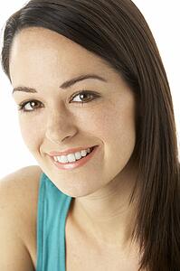 Studio Portrait Of Smiling Woman