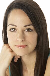 Studio Portrait Of Smiling Woman