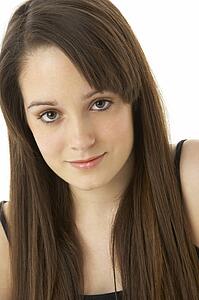Studio Portrait Of Teenage Girl On White Background