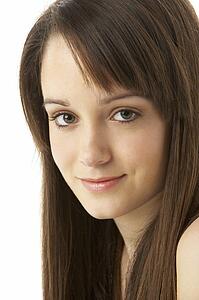 Studio Portrait Of Teenage Girl On White Background