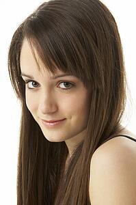 Studio Portrait Of Teenage Girl On White Background