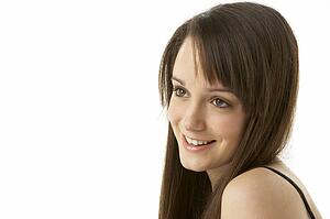 Studio Portrait Of Teenage Girl On White Background