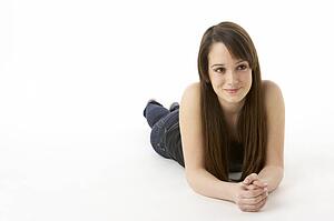 Studio Portrait Of Teenage Girl On White Background