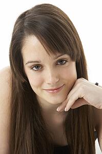 Studio Portrait Of Teenage Girl On White Background
