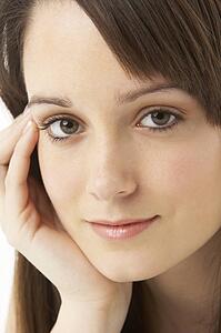 Studio Portrait Of Teenage Girl On White Background